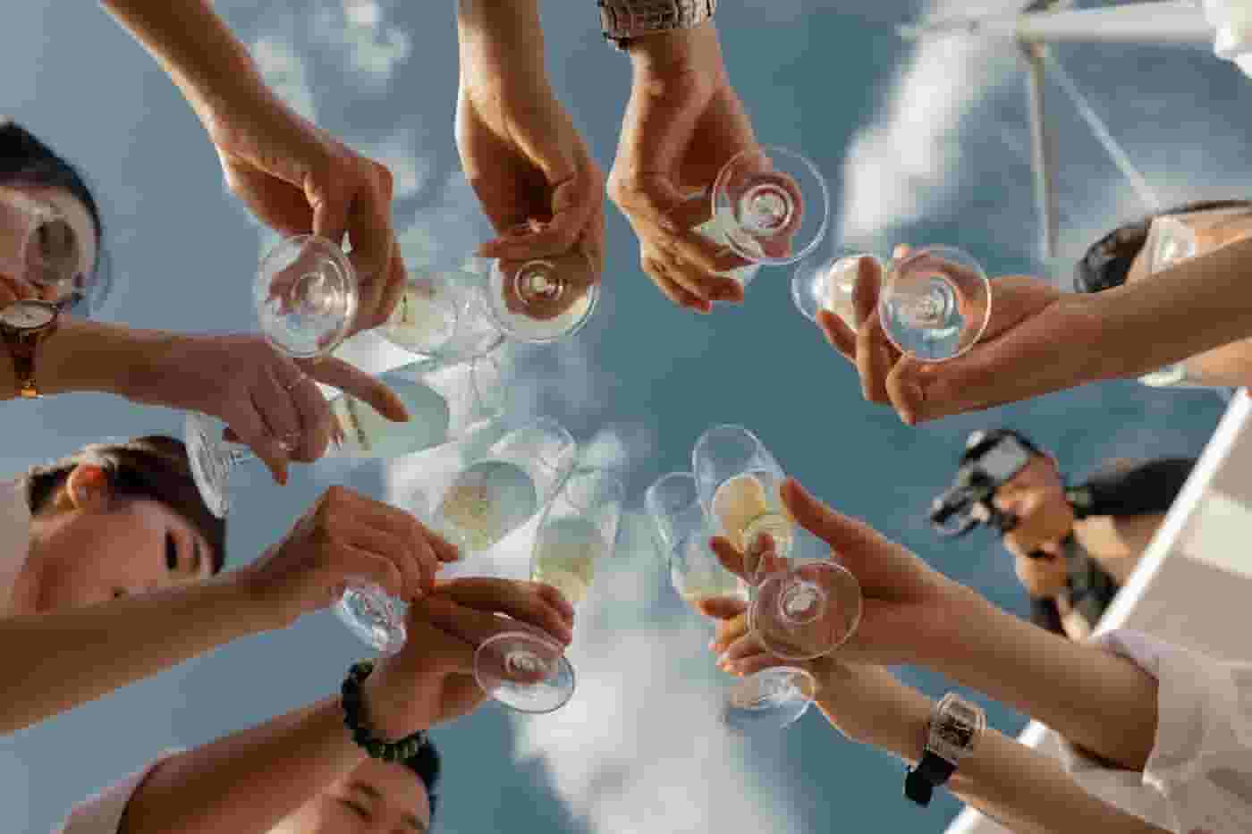 Group of friends with champagne in Bridge District