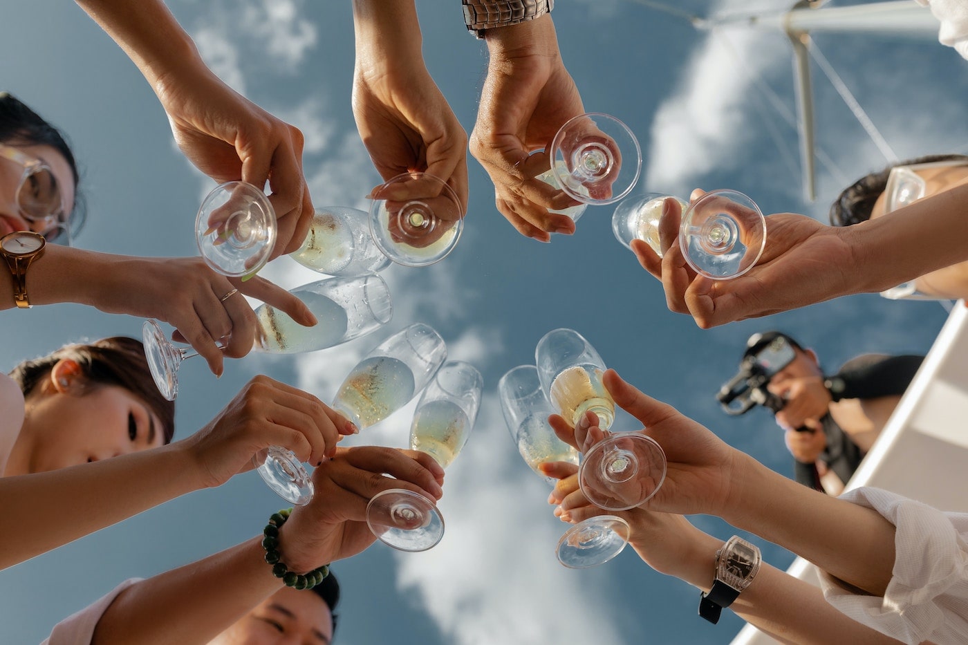 Group of friends with champagne in Bridge District